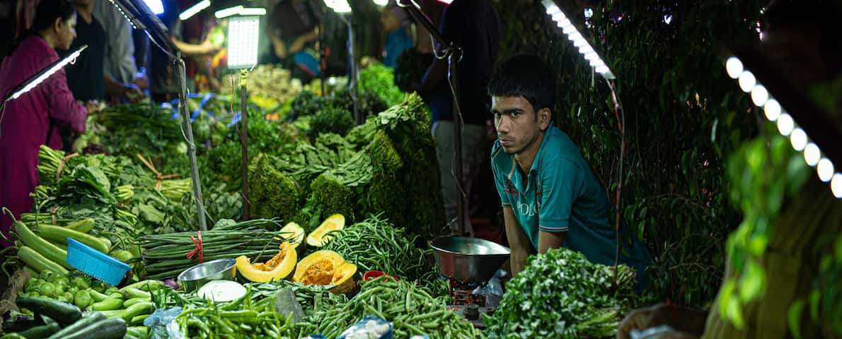 Vendors and customers at the Saturday weekly market in Vasant Kunj, Delhi