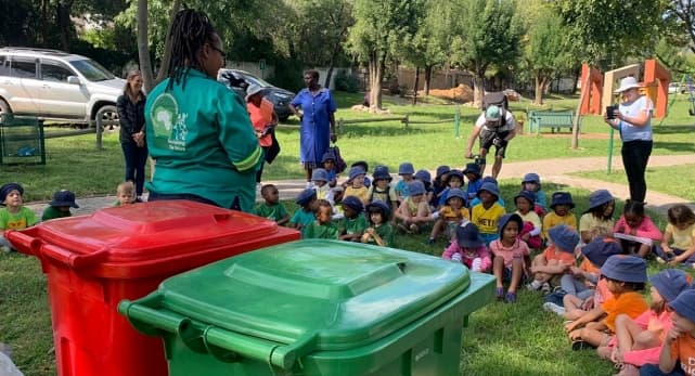 Johannesburg reclaimer teaches children about separating recycling