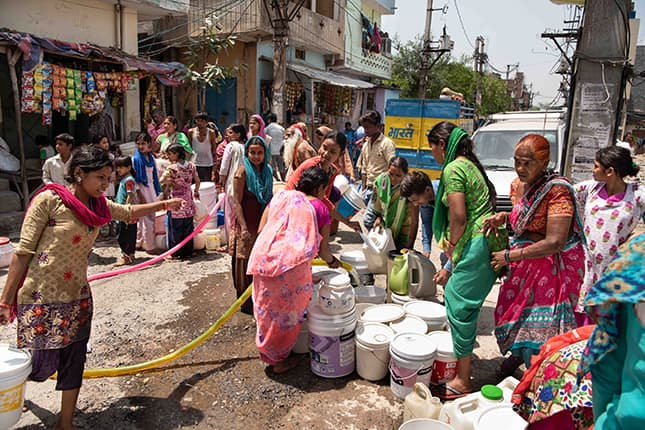 Women collecting water and struggle for basic services.