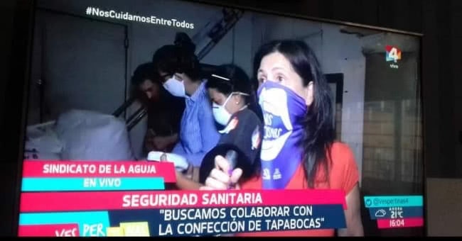 television news screenshot making masks in Uruguay