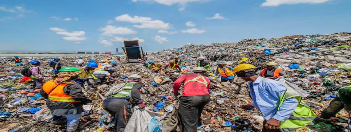 Waste pickers collecting recyclables on Kpone Landfill in Accra, Ghana