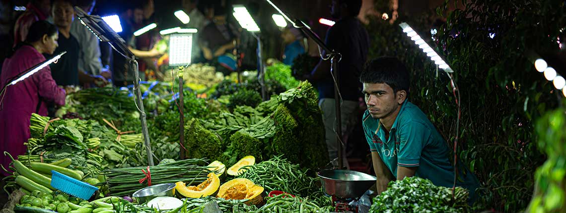 Vendors and customers at the Saturday weekly market in Vasant Kunj, Delhi.