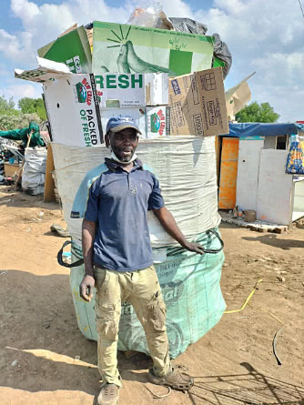 Waste Picker of Mushroomville with his collected materials