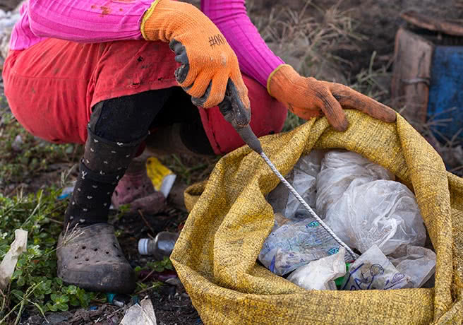 A waste picker at work at the Mbeubeuss dump in Dakar, Senegal