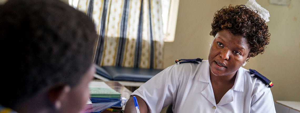 Head antenatal nurse Margie Harriet Egessa providing antenatal counseling and checkups for a group of pregnant women at Mukujju clinic. This clinic is supported by DSW.