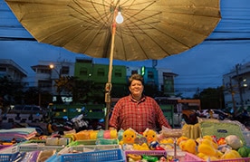 Renu at her stall in Bangkok, Thailand, before the pandemic, in 2015