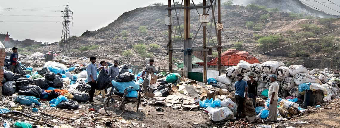 Waste pickers outside the Bhalswa landfill in Delhi
