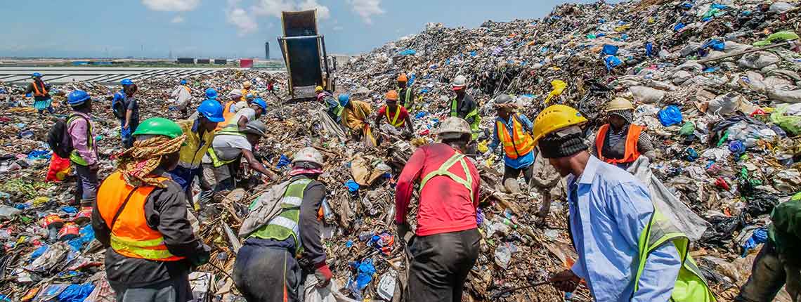 Waste pickers collecting recyclables on Kpone Landfill in Accra, Ghana