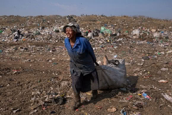 Waste picker in South African landill