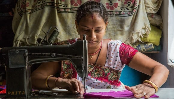 An Indian home-based worker with her sewing machine