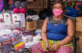 Abena Konadu, a trader at Tema Lorry Station Market, along the footpath to the station.