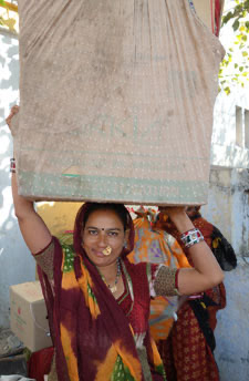 Devi-ben carrying wares