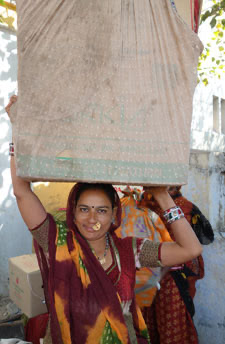 Devi-ben carrying wares