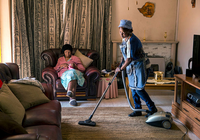 Domestic worker Lucy Mokhahle working at the house of her employer Rose Hamilton. August 18, 2015 in Johannesburg, South Africa. Credit: Jonathan Torgovnik/Getty Images Reportage.