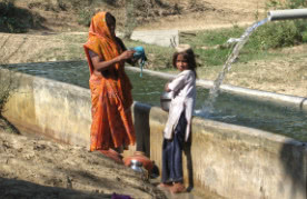 Woman and child washing clothes