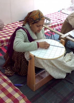 worker embroidering