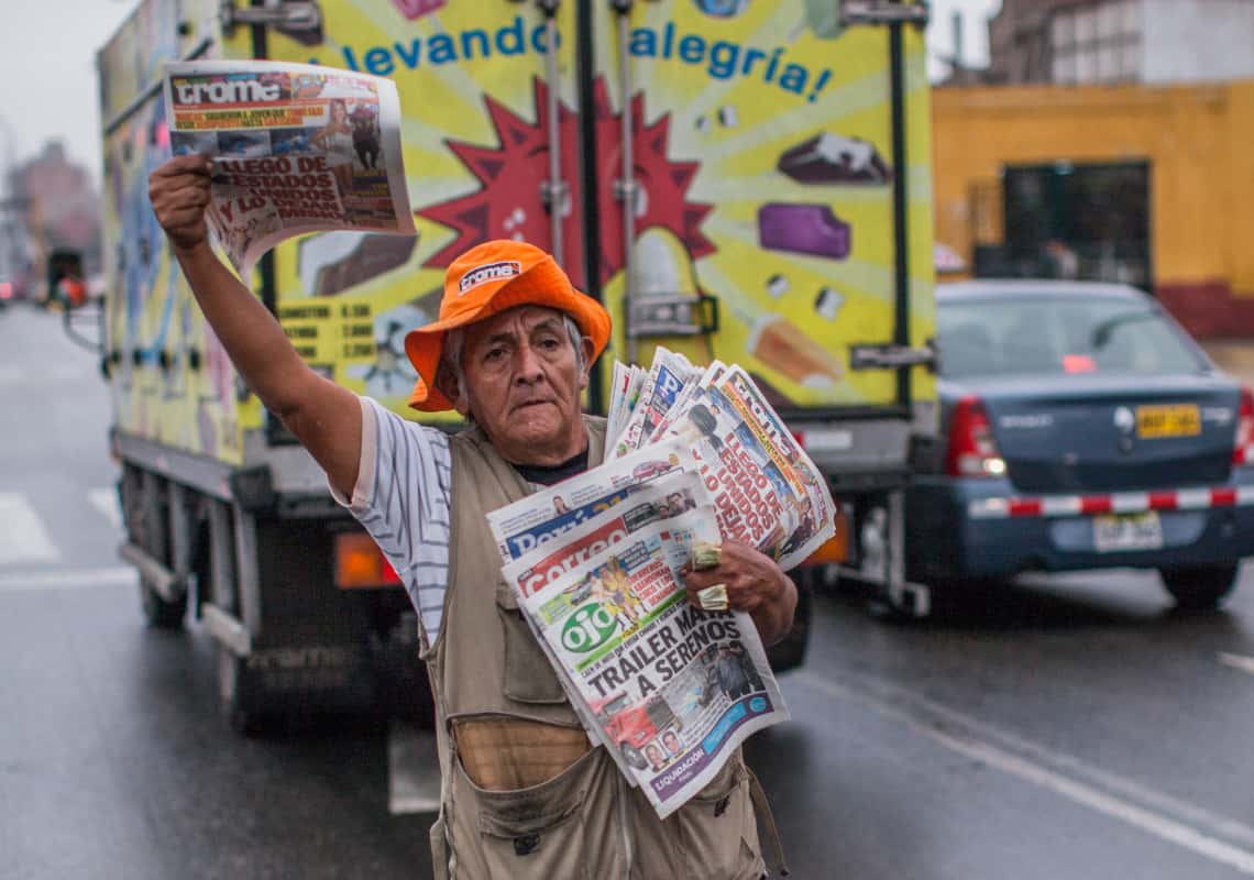 A newspaper vendor in Lima, Peru. Credit: Juan Arredondo/Getty Images Reportage