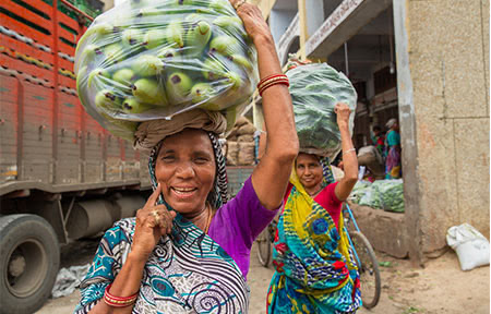 Shantha Solanri does back-breaking work as a head loader in Ahmedabad's teeming main vegetable market.