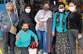 Workers at Calle Mártir Olaya–San Martín de Porres market in Lima