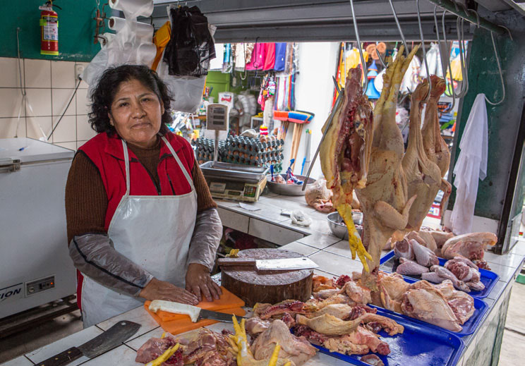 Petrona Flores sells poultry at the Mercado San José in Lima
