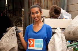 Brazilian catadora at a waste sorting facility