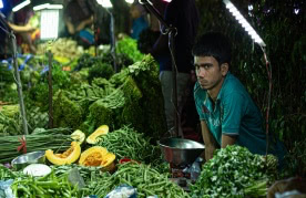 Vendors and customers at the Saturday weekly market in Vasant Kunj, Delhi