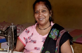 Meenaben at work in her home