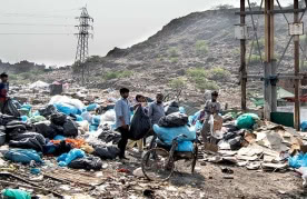 Waste pickers outside the Bhalswa landfill in Delhi