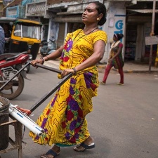 Sangeeta Ben walks her daily route working as a waste picker in an Ahmedabad slum