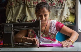 Bhavna Ramesh sews purses at home. Photo: Paula Bronstein/Getty Images/Images of Empowerment